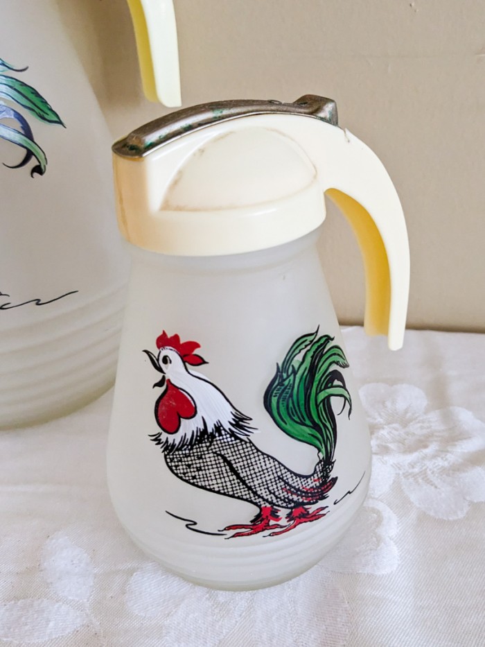 69. (2) Rooster Pitchers + Vintage Measuring Spoon Holder - Image 4