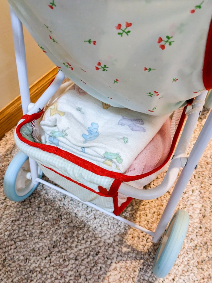 132. Highchair, (2) Baby Dolls + Stroller - Image 6