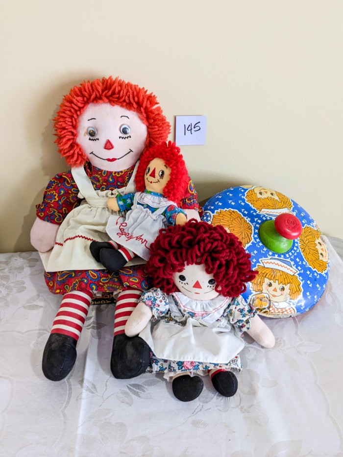 145. Vintage Tin Top, (3) Raggedy Ann Dolls + (5) Books