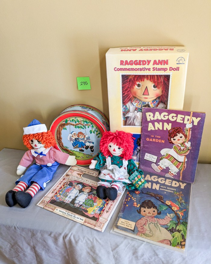 235. Raggedy Ann Dolls, Tin + Books