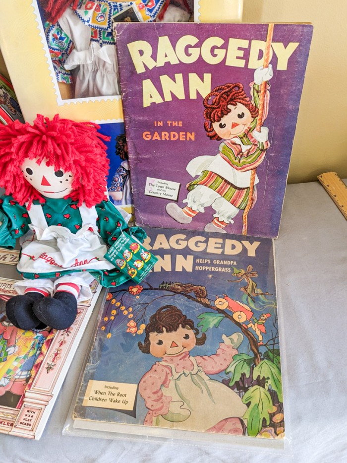 235. Raggedy Ann Dolls, Tin + Books - Image 2