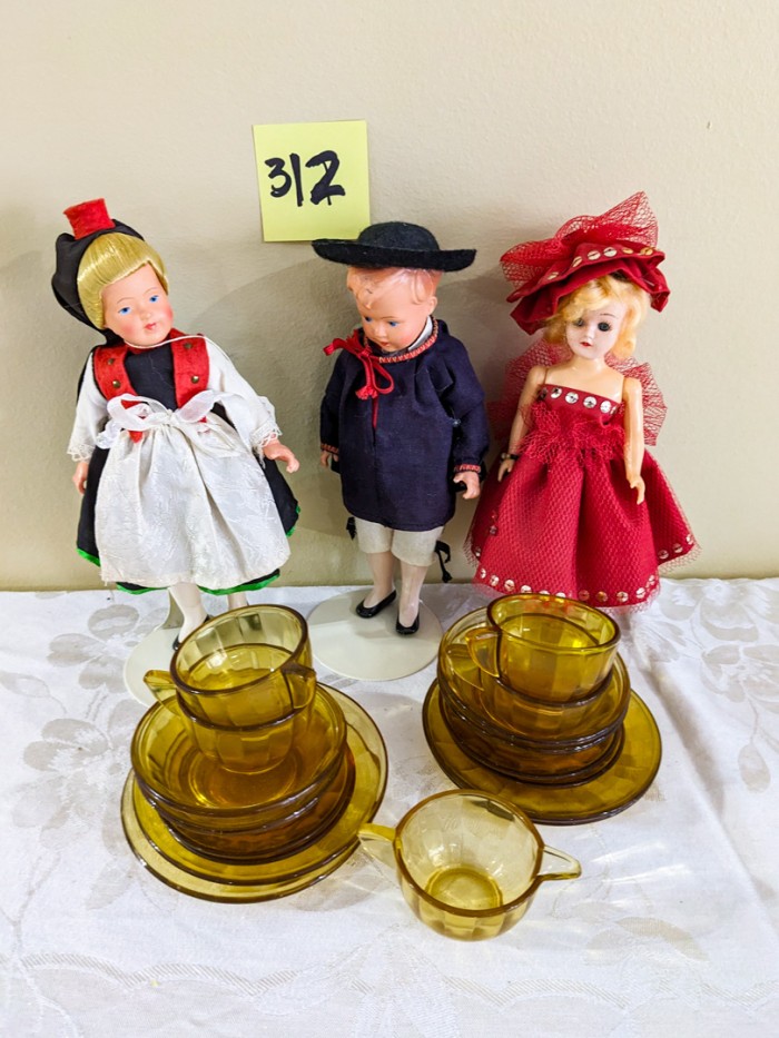 312. (3) Dolls + Mini Amber Tea Set