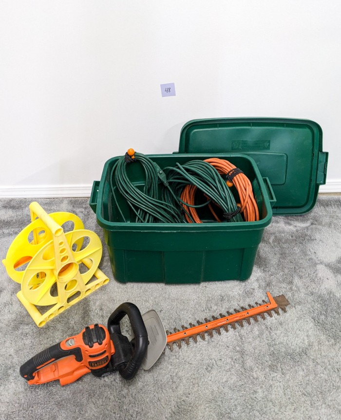 48. Black + Decker Hedge Trimmer, Hose Reel + Extension Cords