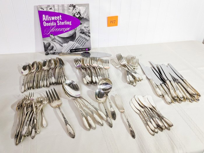 147. Oneida Sterling Flatware - (24) Teaspoons, (24) Salad Forks, (12) Dinner Knives, (12) Dinner Forks, (23) Cocktail Forks, (12) Spreaders, (9) Serving Pieces