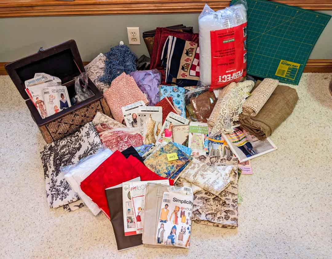 443. Sewing/Craft Lot – Fabric, Cutting Mat, Books + Notions