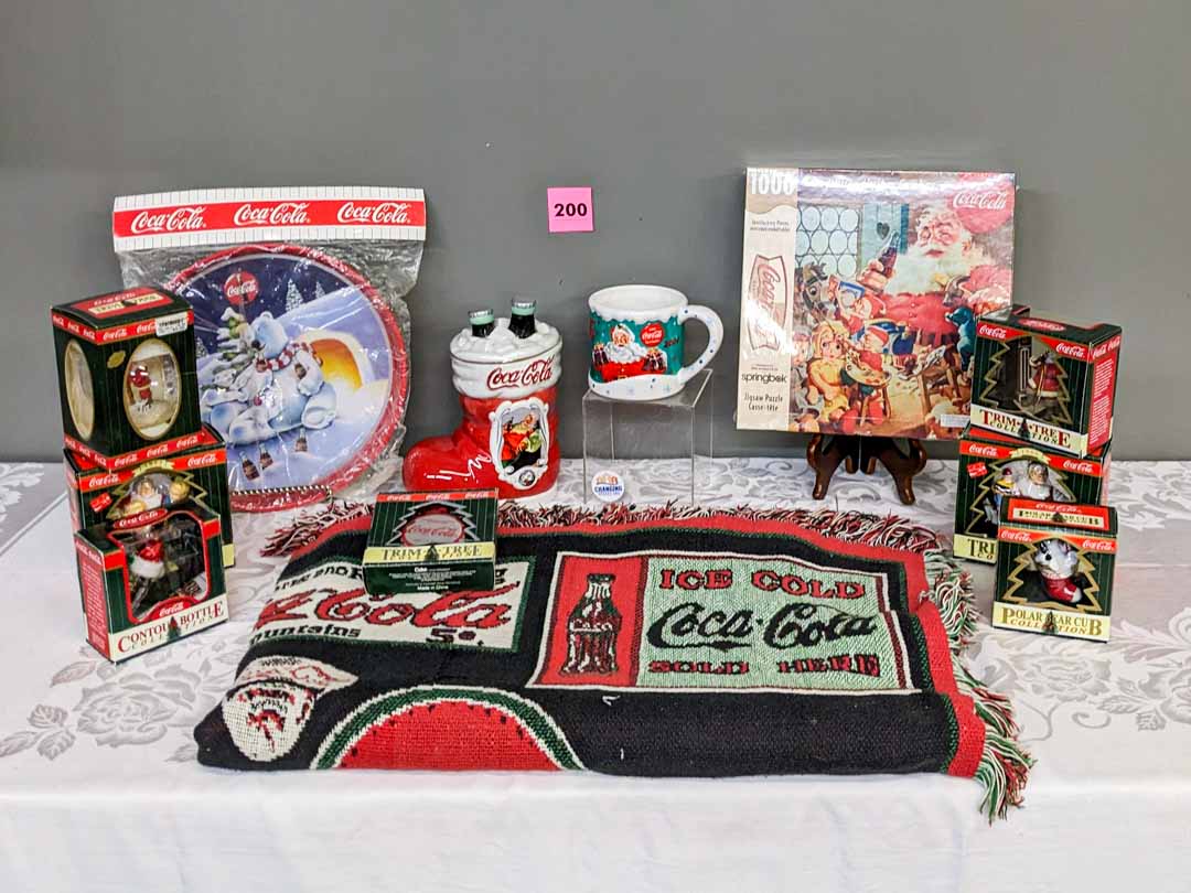 200. Coca Cola Throw + Puzzle + Tray + (2) Mugs + (7) Ornaments